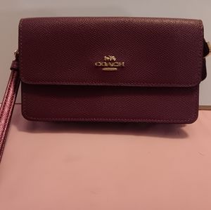 Coach purple/ burgundy wristlet purse/ wallet with zipper section in the back